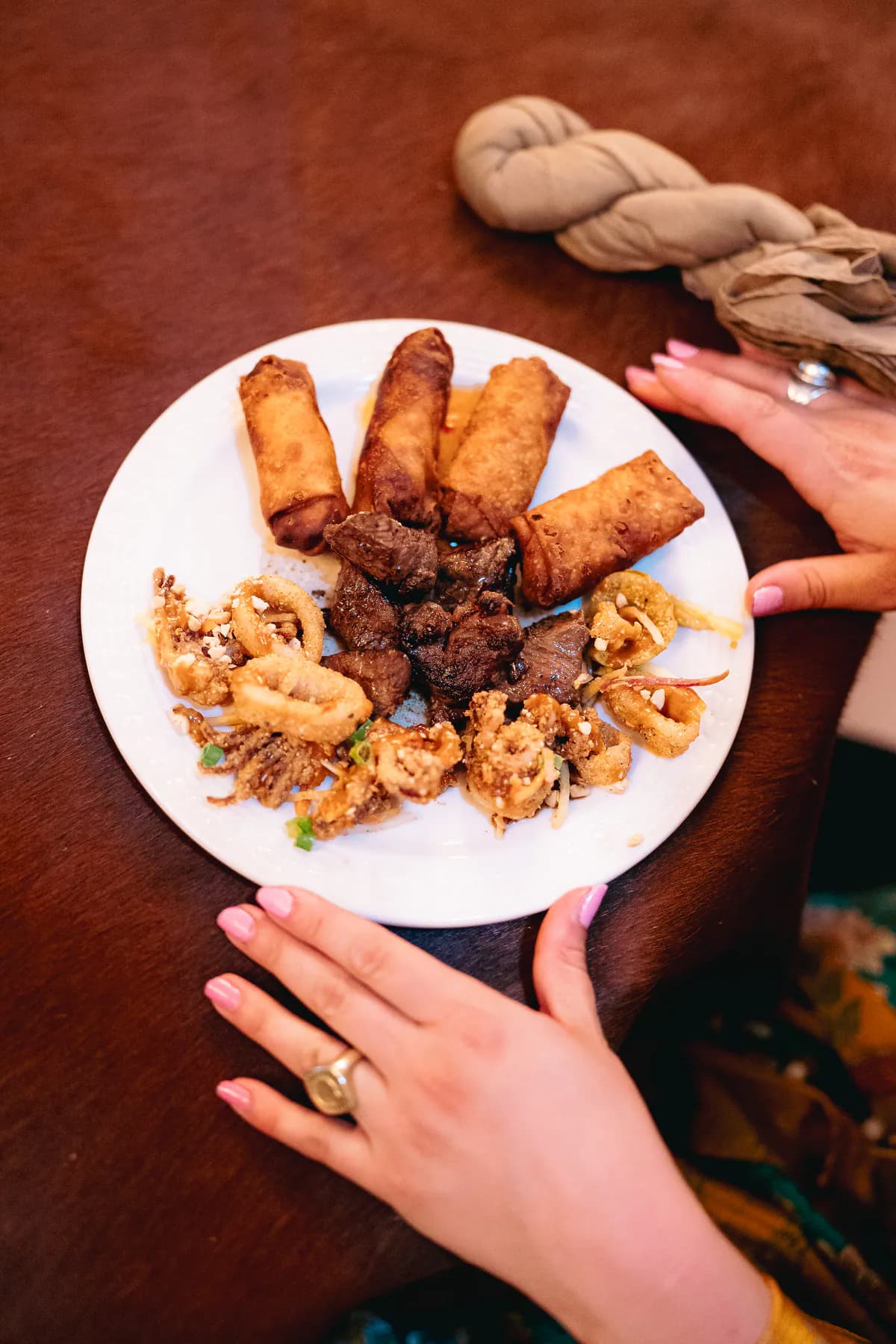 A plate of passed appetizers being served at a Heritage Hall catered event.